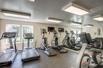 The gym has cardio equipment and various exercise machines